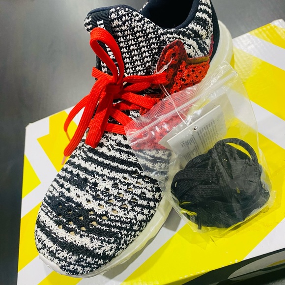 Brand new adidas Ultra boost Clima, size 6.5 US black and white with red lace.